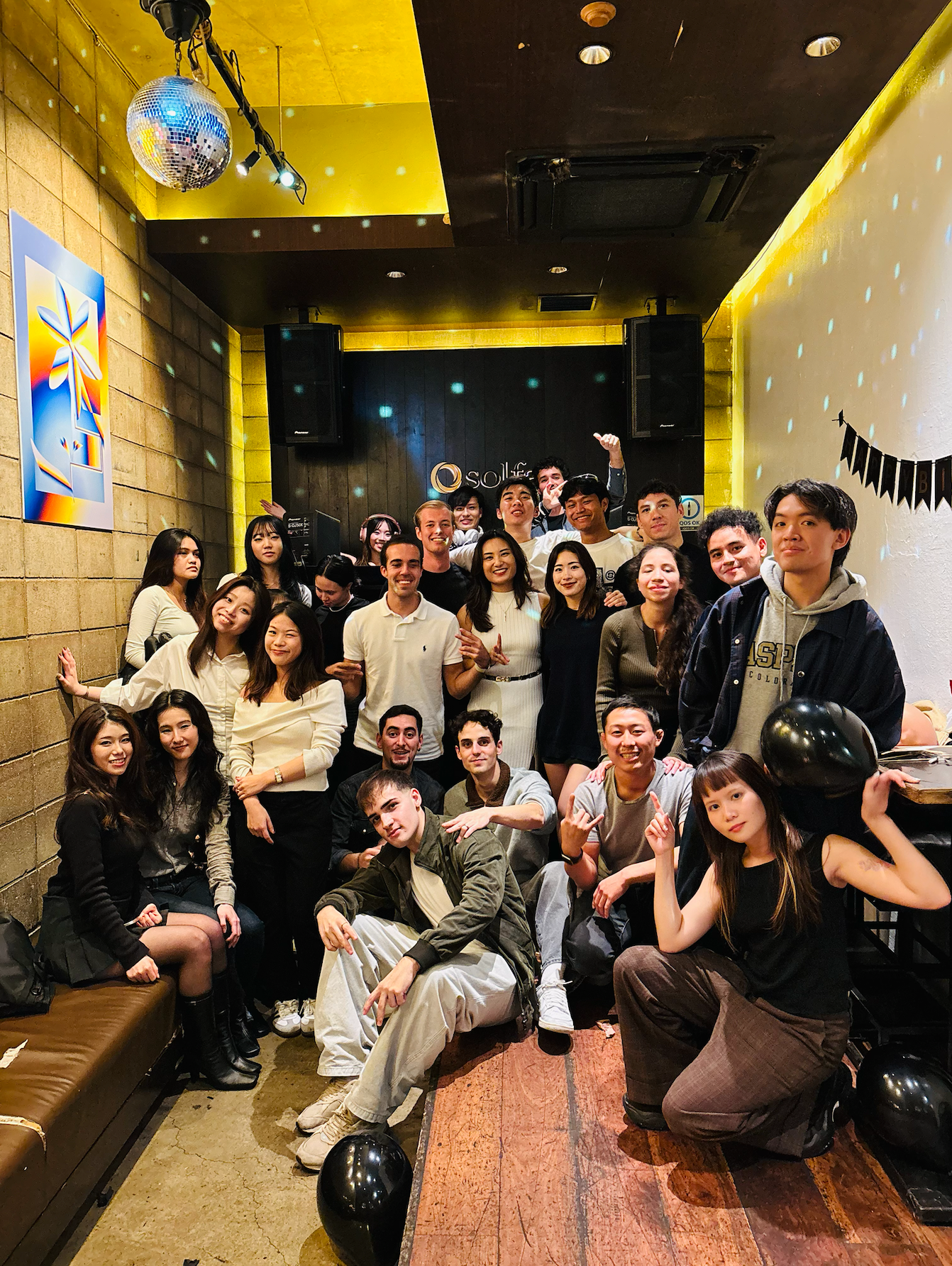 Group photo from the birthday event at Solfa
